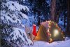 a-tent-set-up-in-the-woods-with-christmas-lights-and-stocking-near-anchorage-alaska,1403610~2.jpg